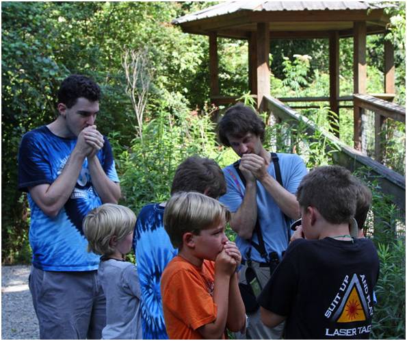 LABO volunteer, Eric Liffman, teaching local kids how to mimic Eastern Screech Owl calls at Bluebonnet Swamp. Photo by John Hartgerink.